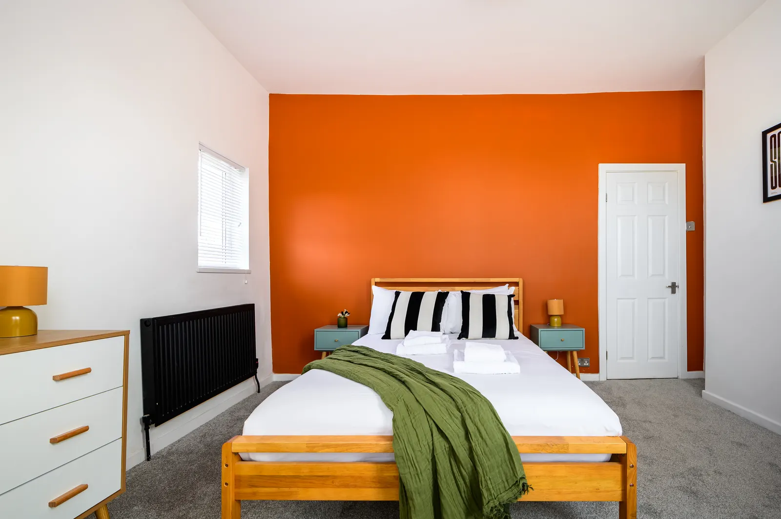 The refurbishment gave Rolls Crescent a distinct visual identity. Character stock with confident styling pulls its own repeat bookings. Manchester house bedroom with bold accent styling