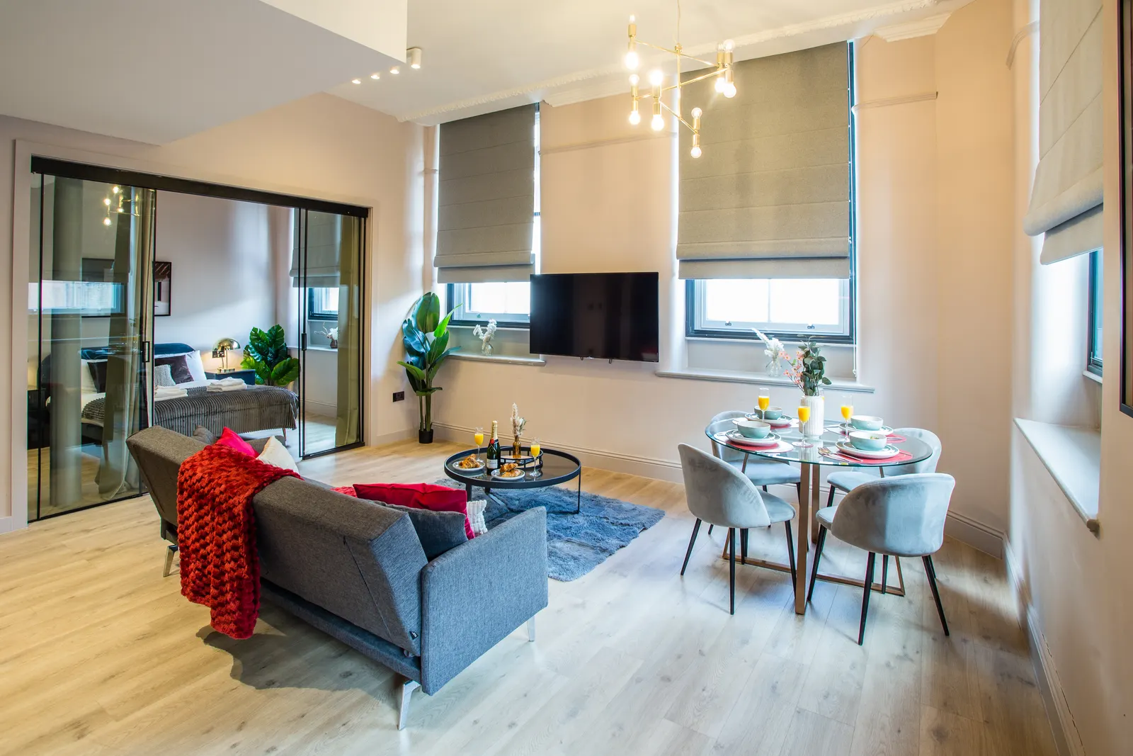 One of the central Manchester apartments we operate. Consistent finish, professional photography, and pricing tuned per unit are the starting line, not the finish line. Central Manchester serviced apartment interior with designer finish and gold chandelier